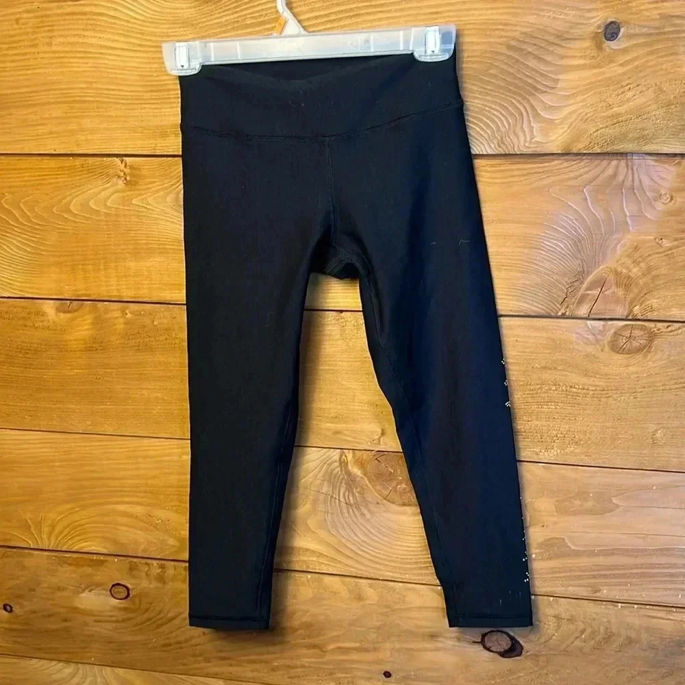 Revolve Krisa womens Capri leggings black single leg embellishment XS oversized